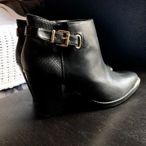 Black and gold boots